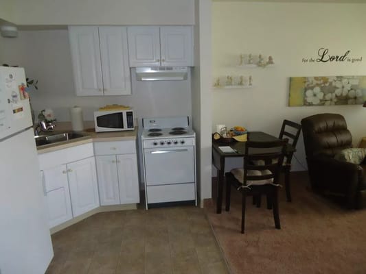 A kitchen area in a retirement community apartment