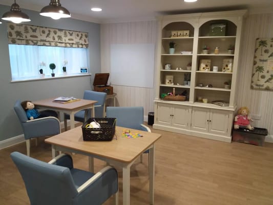 Cozy common area with tables and seating for activities