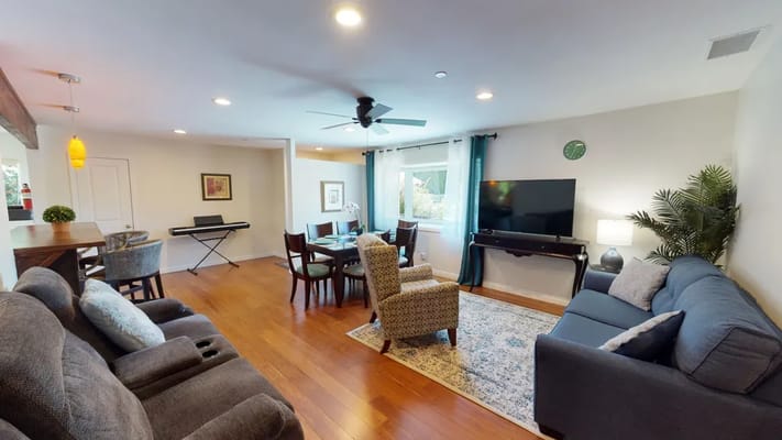Bright common area with seating and dining space