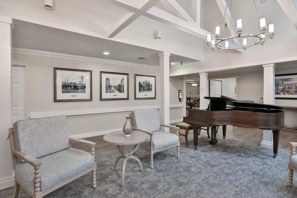 Cozy lounge area with seating and piano