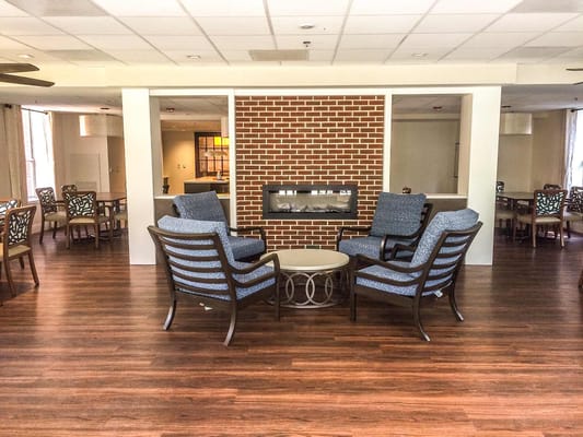 Lounge with armchairs and a decorative fireplace