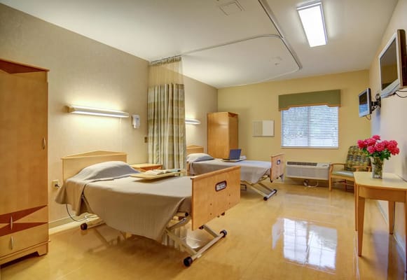Interior view of a shared resident room with beds