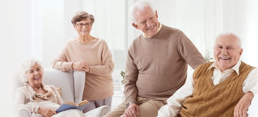Seniors enjoying conversation in a common area