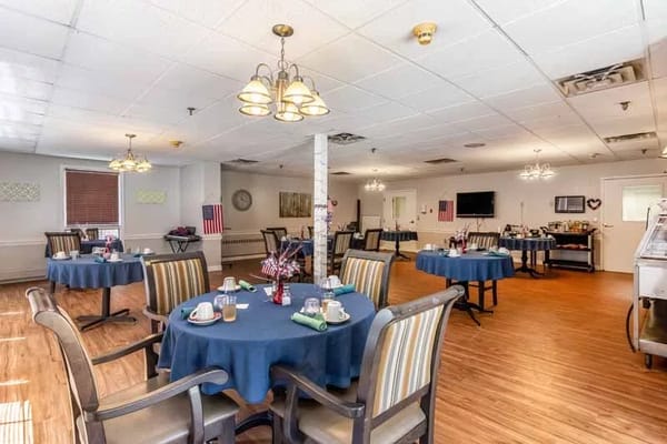 Dining area with blue tablecloths and seating