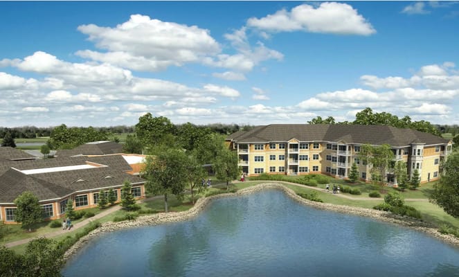 Aerial view of Porters Neck Village with buildings and pond