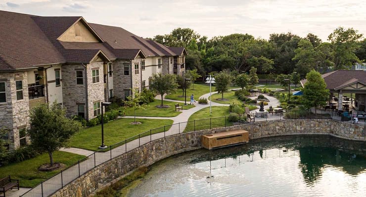 Aerial view of the facility's exterior and surrounding gardens