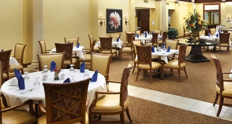 Dining area with tables set for residents