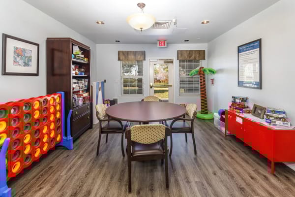 Bright activity room with games and tables