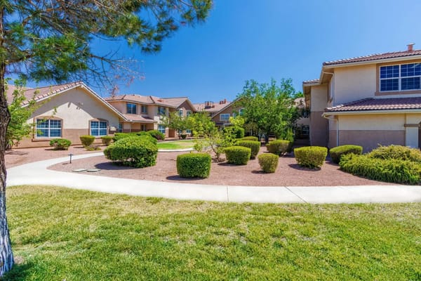 Well-maintained garden and pathways in a senior living community