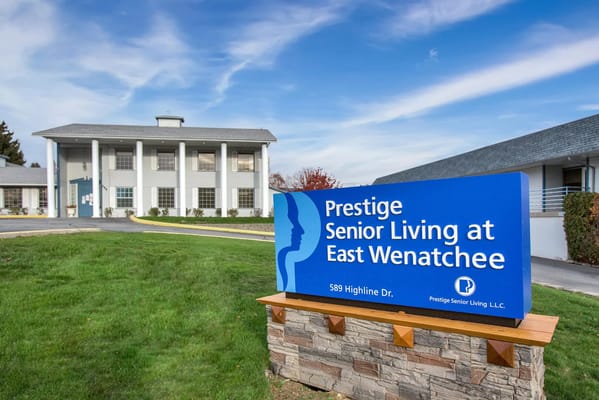 Exterior view of Prestige Senior Living building and sign