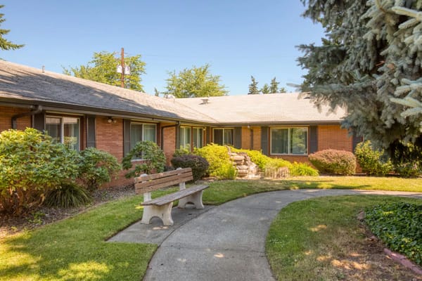 Beautiful outdoor area with benches and greenery