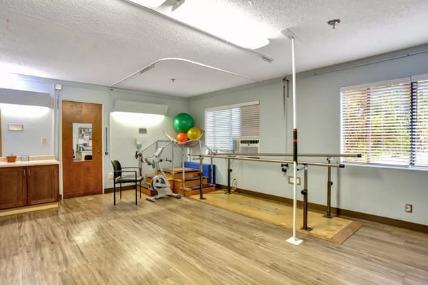 Rehabilitation room with equipment and colorful balloons