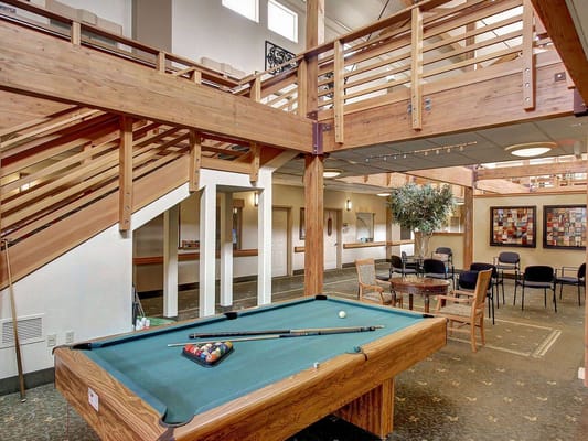 Interior common area with a pool table and seating