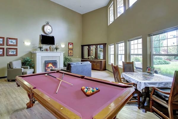Interior view of a common area with a pool table