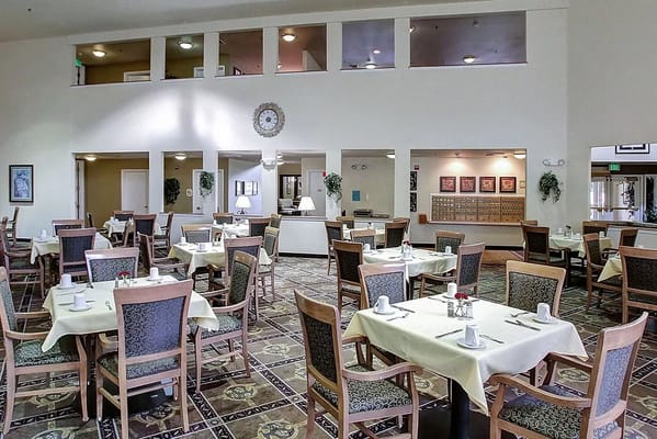 Dining room setup with tables and chairs