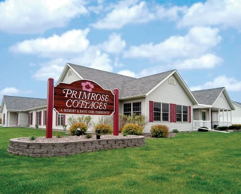 Exterior view of Primrose Cottages with sign