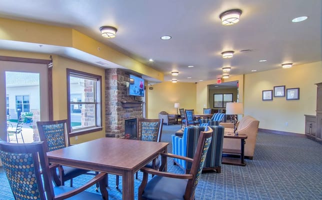 Cozy lounge area with seating and a fireplace