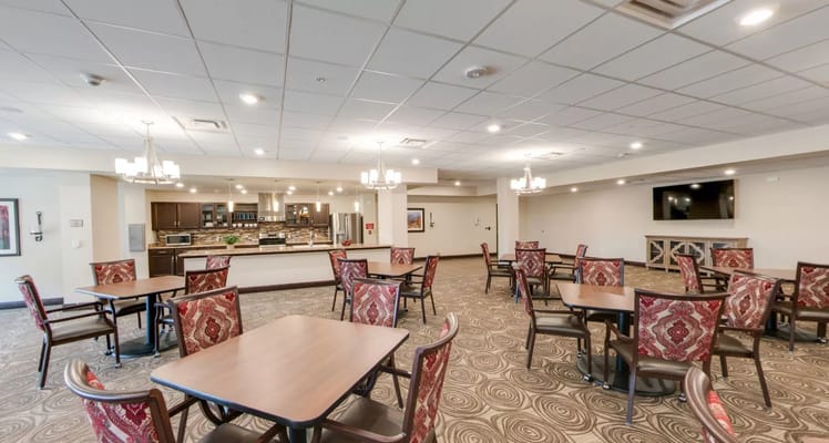 Dining room with tables and chairs in a well-lit area