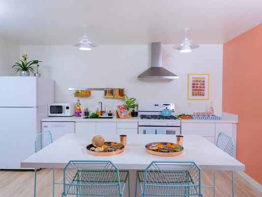 Bright modern kitchen with a dining table and food