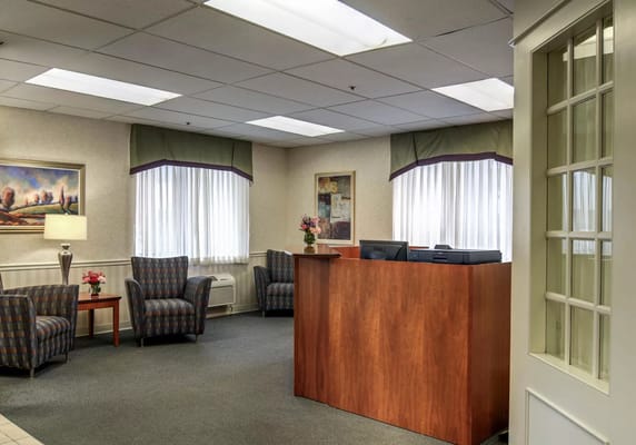 Reception area with seating and a desk at ProMedica Skilled Nursing and Rehabilitation.