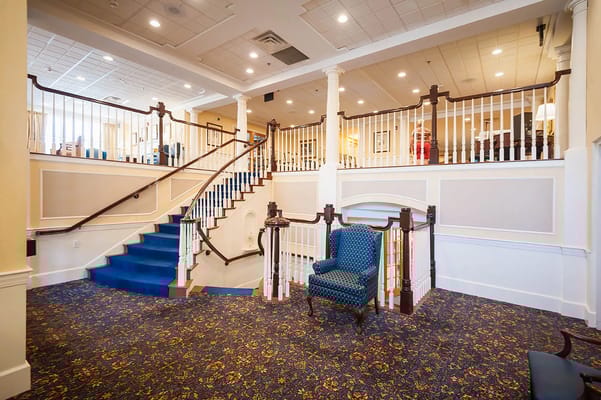 Interior view of a spacious lobby with staircase