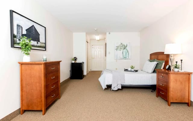 Cozy private resident room with wooden furniture
