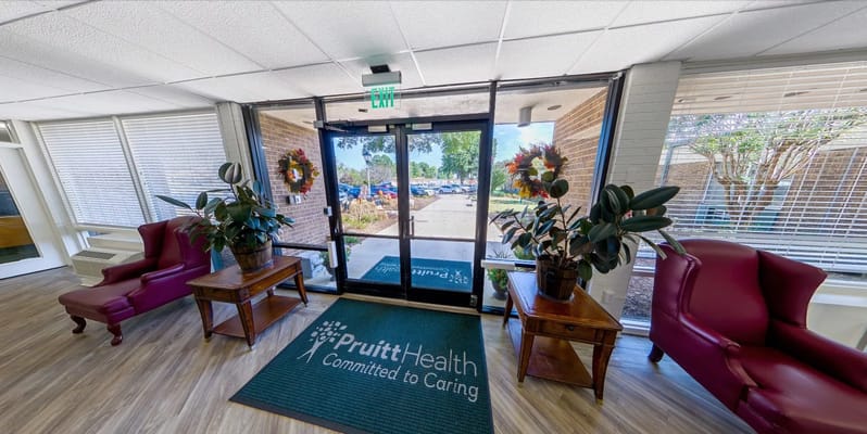 Welcoming interior entrance with doors and seating