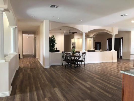 Interior view of a spacious common area with dining set