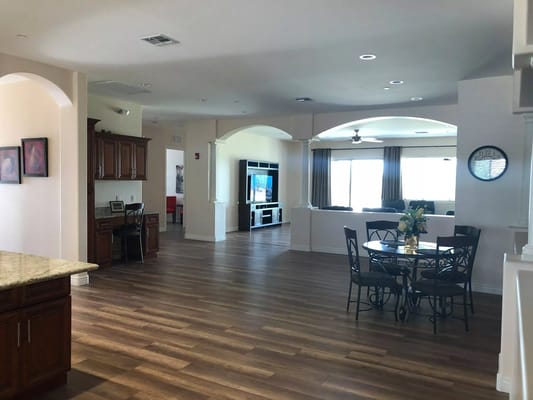 Bright interior common area with seating and TV