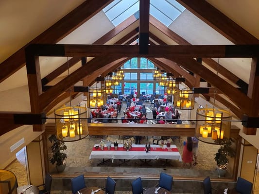 View of the dining area with tables decorated for an event