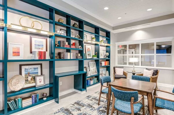 Cozy common area with bookshelves and seating