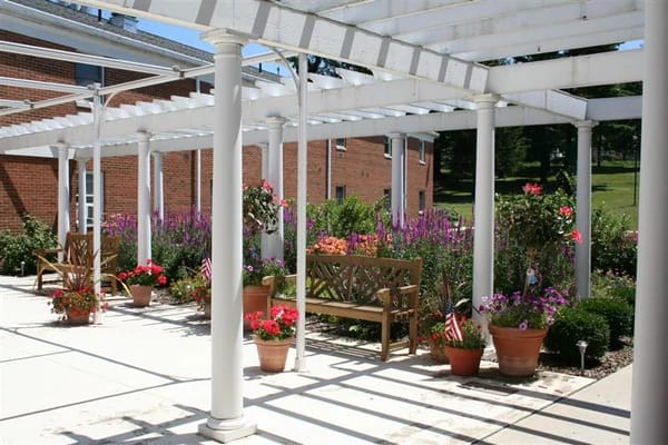 A vibrant outdoor space with flowers and benches