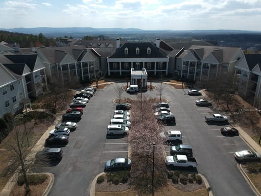 Aerial view of Redstone Village with parking and building.