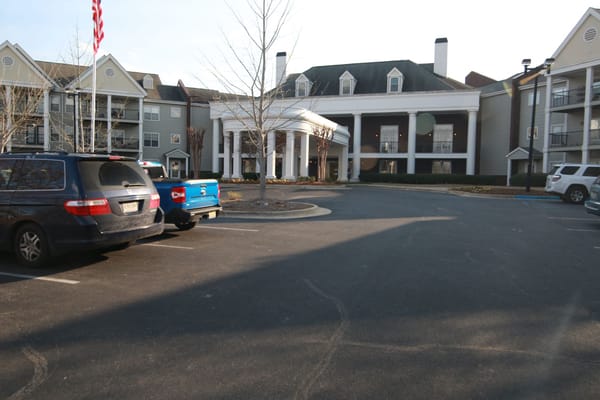 Exterior view of Redstone Village with parked cars