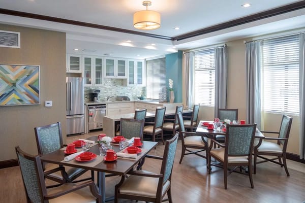 Bright dining room with tables set for meal service