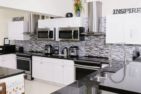 Spacious kitchen with modern appliances.