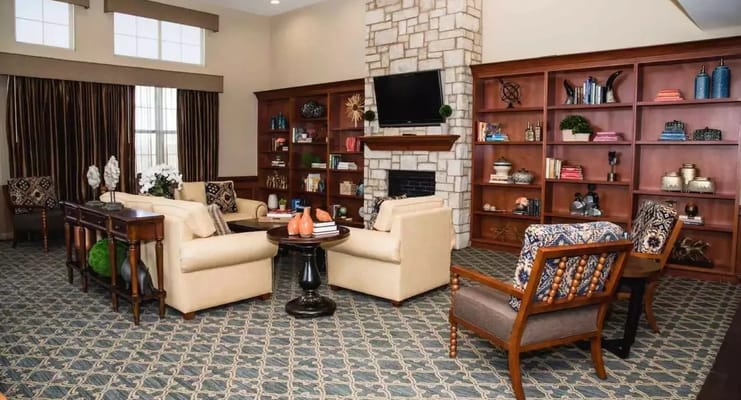 Comfortable lounge area with seating and bookshelves
