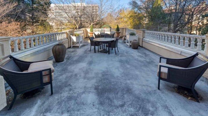 Patio area with seating and plants at Renaissance on Peachtree.