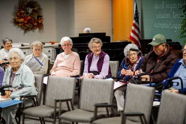 Residents engaged in a group activity in a common area