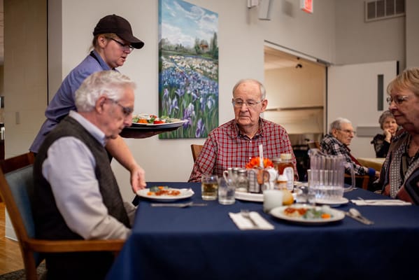 Residents enjoying a meal in the dining room
