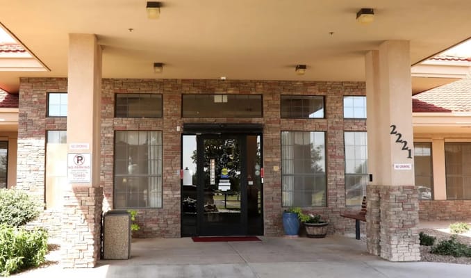 Main entrance of Retirement Ranch facility with landscaping