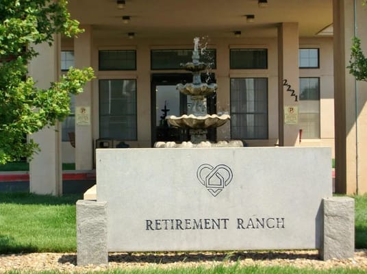 Entrance sign and fountain of Retirement Ranch
