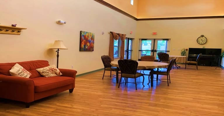 Bright common area with seating and tables