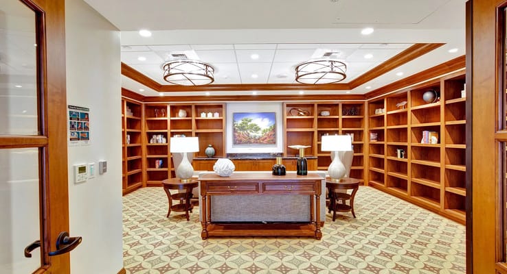 Interior view of a common area with bookshelves and decor