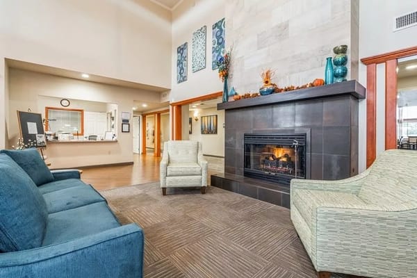 Comfortable living room with fireplace and seating at Ridgeview Place