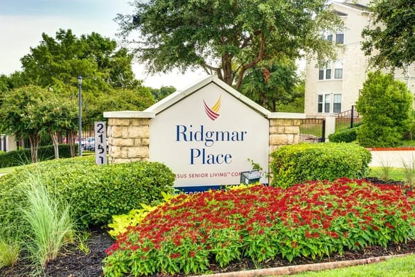 Entrance sign for Ridgmar Place with landscaping