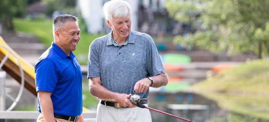 Residents enjoying time outdoors with staff