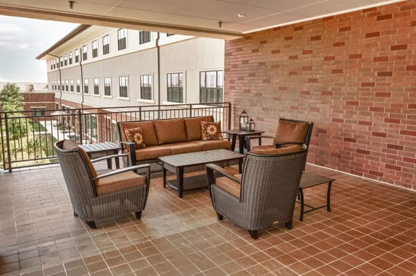 Outdoor seating area with comfortable furniture.