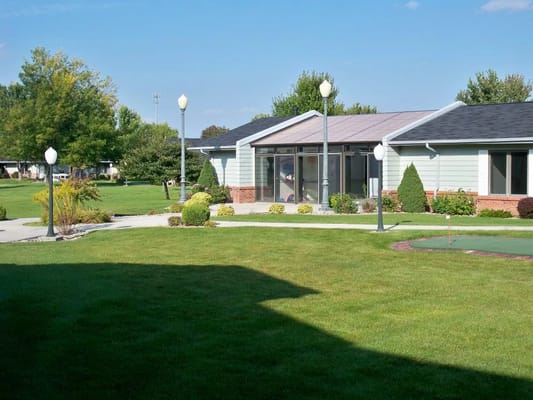 Exterior view of Riverside Lodge with landscaped grounds