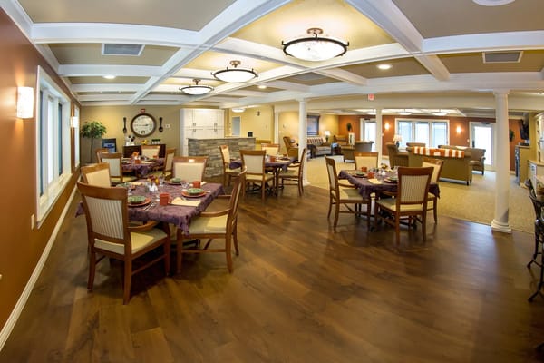 Bright dining area with tables set for a meal